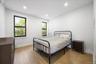 Bedroom with light wood-type flooring and recessed lighting
