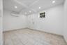Unfurnished room featuring recessed lighting, beam ceiling, and a wall mounted AC