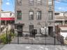 Italianate home featuring brick siding