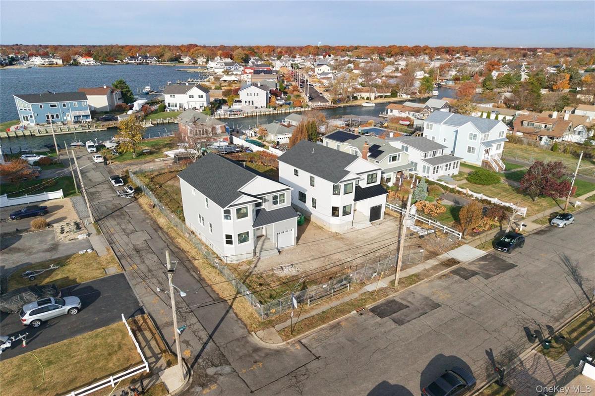 Aerial view of residential area with a large body of water