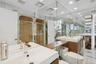 Bathroom featuring a shower stall, recessed lighting, and vanity
