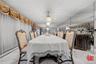 Dining area featuring marble finish flooring, baseboard heating, a textured ceiling, and recessed lighting