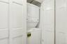 Washroom with stacked washer / dryer