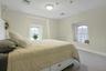 Carpeted bedroom featuring baseboards