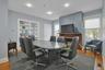 Home office featuring hardwood / wood-style floors and recessed lighting