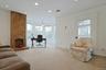 Home office featuring carpet, recessed lighting, and a large fireplace