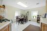 Dining area with light tile patterned floors