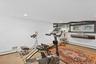 Exercise room featuring recessed lighting, baseboard heating, and carpet floors