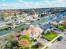 Aerial view of residential area featuring a nearby body of water
