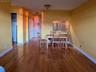 Dining area with sink and light wood-type flooring