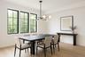 Dining area with light wood finished floors and a chandelier