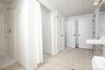 Full bath with a stall shower, light tile patterned floors, a paneled ceiling