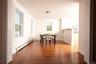 Dining room with a baseboard heating unit and wood finished floors