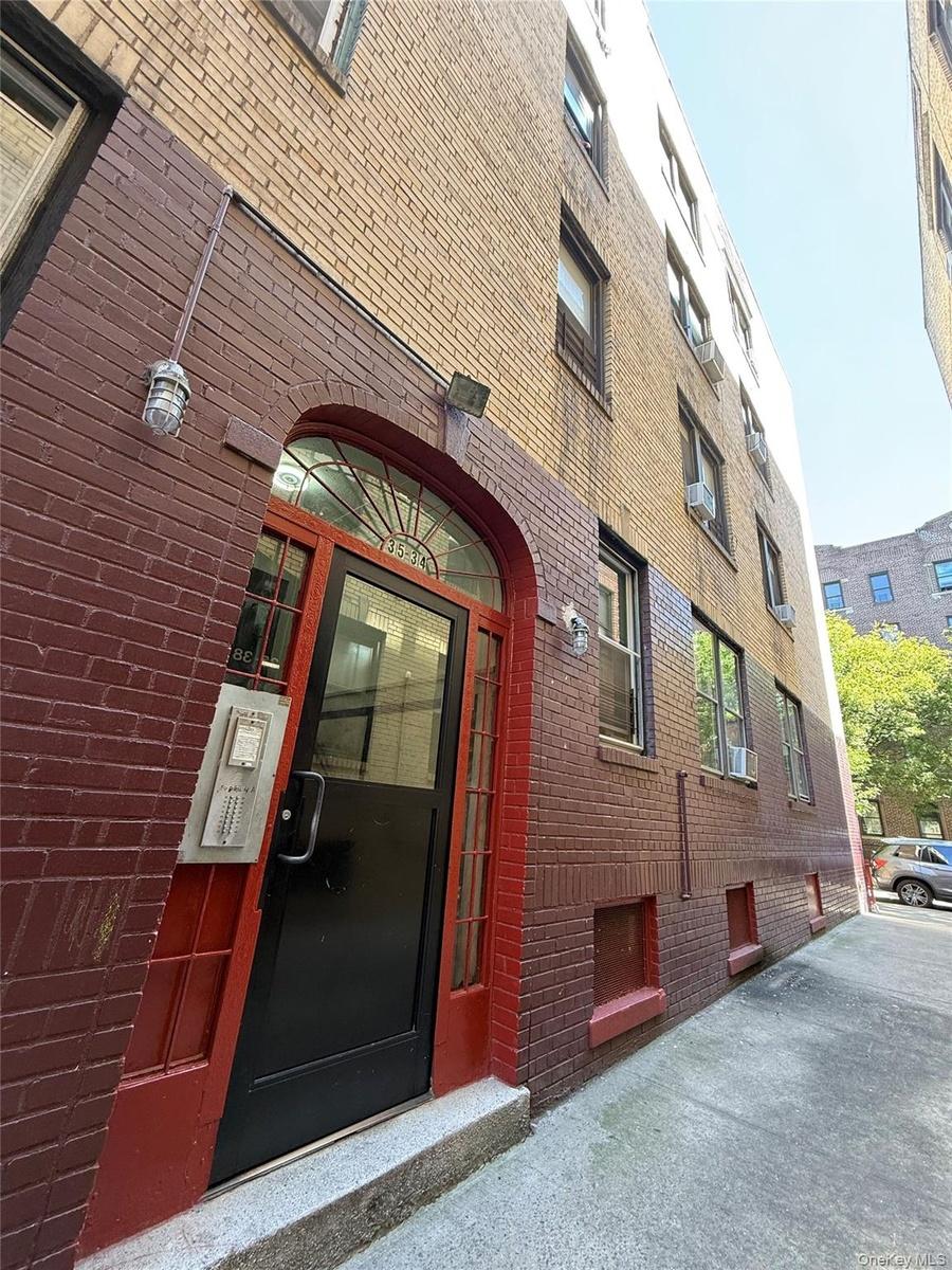 Entrance to property with brick siding