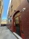 Property entrance with brick siding