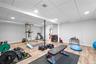 Workout area featuring a drop ceiling, recessed lighting, and light wood-style flooring