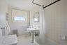 Bathroom featuring crown molding, toilet, and shower / bath combination