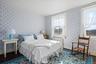 Bedroom with hardwood flooring