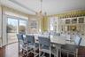 Dining room featuring an inviting chandelier and dark hardwood flooring