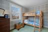 Bedroom with hardwood flooring