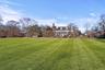 Expansive Lawn with room for pool and tennis court