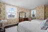 Bedroom with hardwood flooring