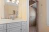 Primary Bathroom featuring tiled shower, and vanity