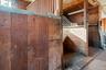 View of horse barn with stalls