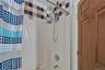 Full bath featuring shower / bath combo