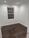 Unfurnished room featuring dark wood-type flooring and recessed lighting