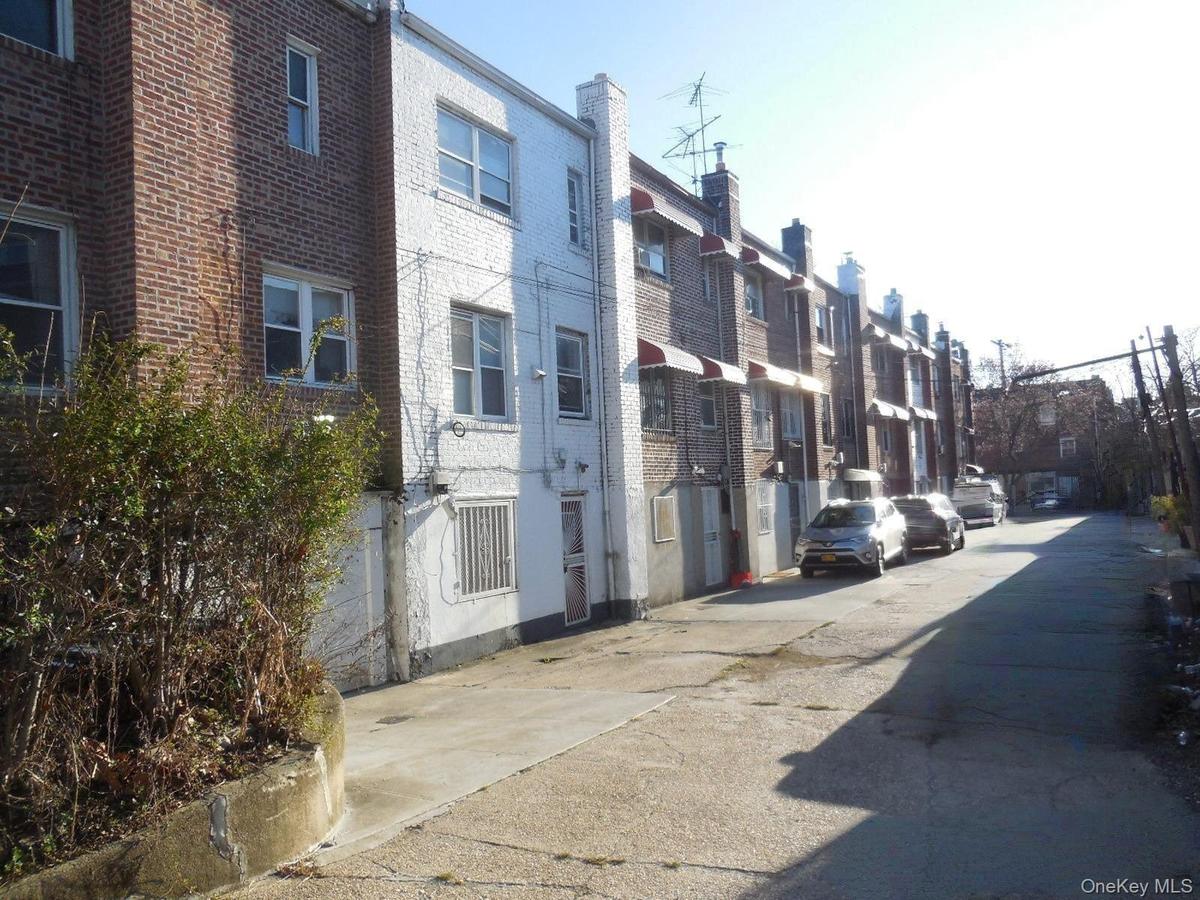 View of asphalt alley with a residential view