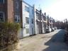 View of asphalt alley with a residential view