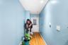 Corridor with hardwood / wood-style flooring and baseboards