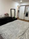 Bedroom with wood finished floors
