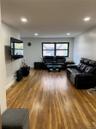 Living room with hardwood / wood-style flooring and recessed lighting