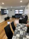 Living room featuring wood finished floors and recessed lighting
