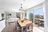 Dining space with a fireplace and wood finished floors