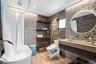 Bathroom featuring tile walls, vanity, light wood finished floors, a shower with curtain, and a chandelier