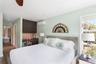 Bedroom featuring dark wood-style floors, recessed lighting, and a wall mounted air conditioner