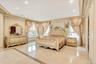 Bedroom featuring ornamental molding, tile patterned flooring, and recessed lighting