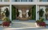 Double-height entrance foyer with designer chandelier, Hermès-inspired mansion Dubai