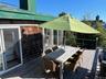 Deck with outdoor dining area and a grill