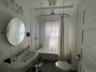 Bathroom featuring toilet and shower / tub combo