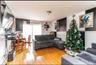 Living room with wood finished floors and baseboard heating