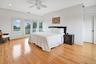 Second Floor Primary Bedroom featuring access to exterior, crown molding, light wood finished floors, ceiling fan, and recessed lighting