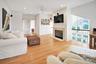 Second Floor Living area with ornamental molding, recessed lighting, light wood-style floors, a ceiling fan, and a glass covered fireplace. Gorgeous V