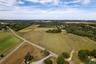 Aerial view of property's location featuring rural landscape and large plots for crops
