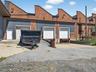 Garage featuring driveway