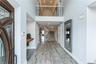 Entrance foyer featuring a high ceiling and light hardwood / wood-style floors