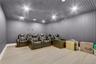 Basement Cinema room with wood finished floors